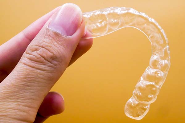 Orthodontist Tips for Choosing Between Braces or Aligners from Smile By Dr. K in Chatsworth, CA